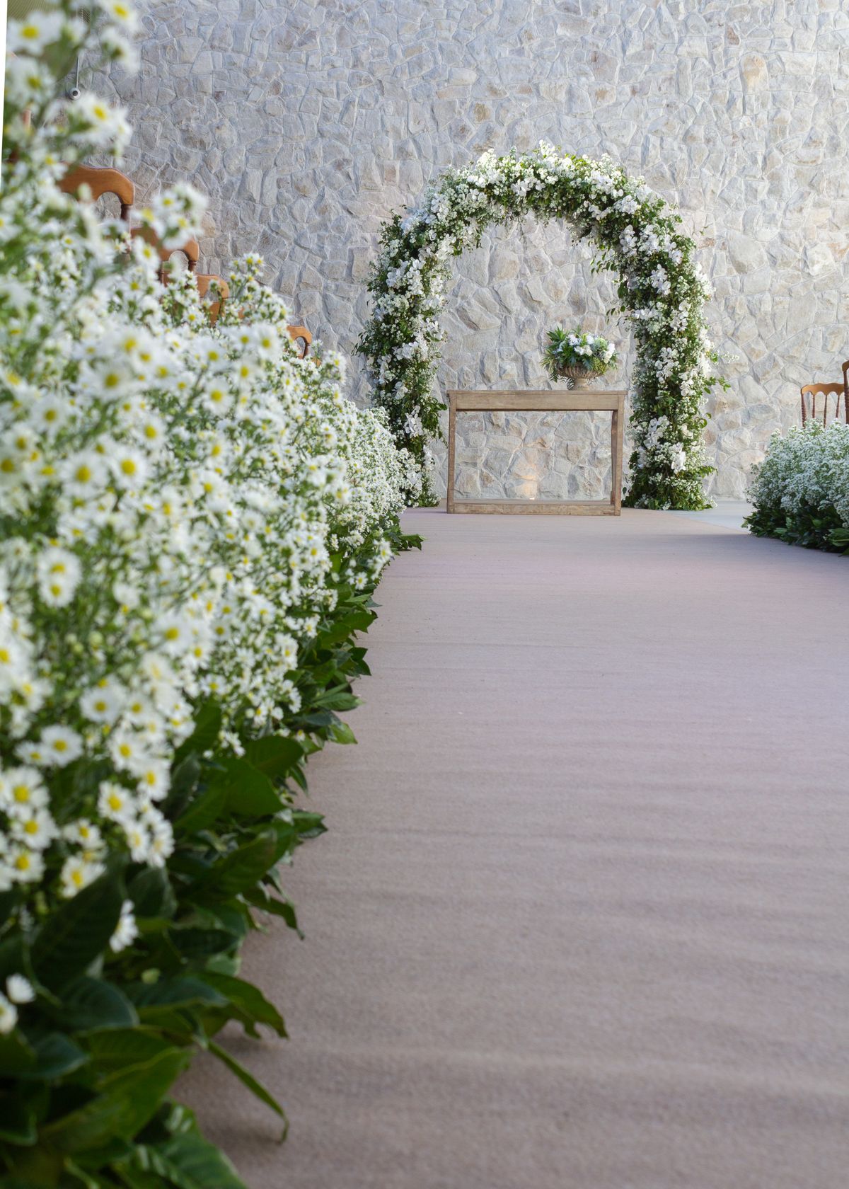 Editorial sample of a white floral wedding arch