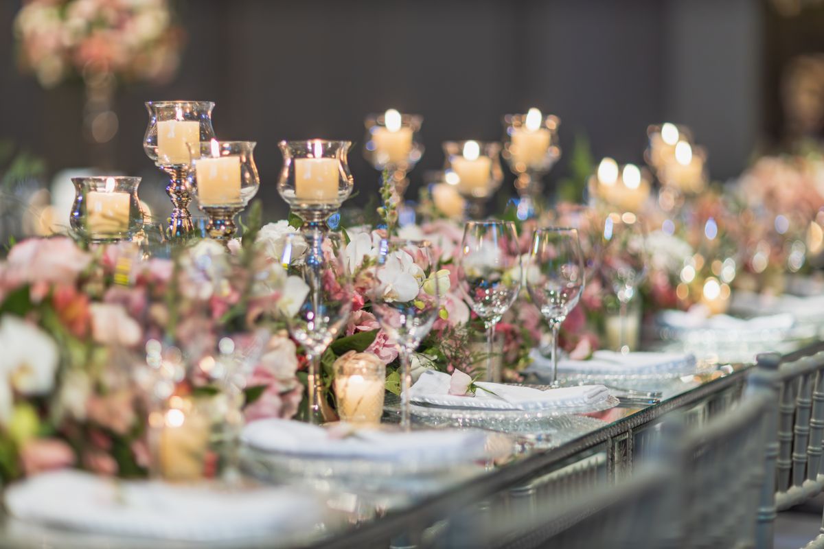 Editorial sample of candles and flowers on a wedding table